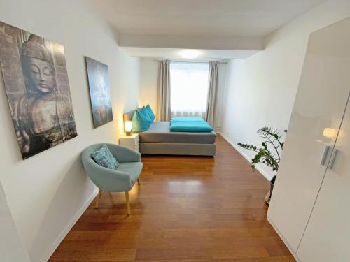 a living room with a couch and a chair at Jacky & Daniel's Apartments Top 1 in Sankt Pölten
