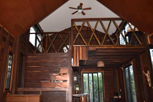 a room with wooden walls and a ceiling at Eco Aldea kinich Ahau in Xpujil