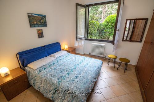 Кровать или кровати в номере La casa dei pini