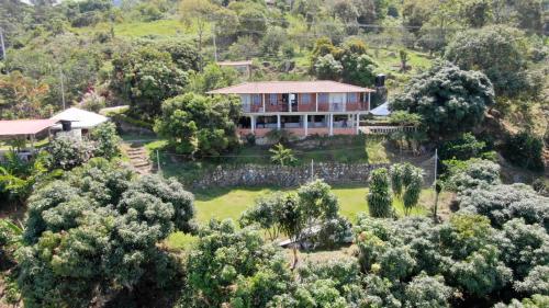 an aerial view of a house in the trees at Finca Agua Viva in Viotá