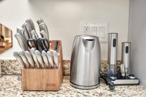 a kitchen counter with a knife block and a blender at 3BR/3.5BA Three Story East Downtown TownHouse with view in Houston