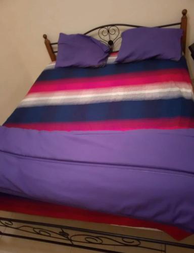 Ένα ή περισσότερα κρεβάτια σε δωμάτιο στο Nafissa