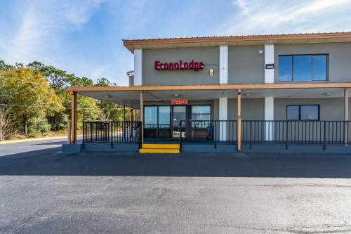 a building with a sign on the side of it at Econo Lodge in Crestview