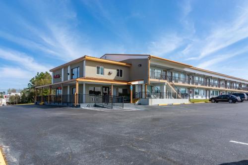 a building with a parking lot in front of it at Econo Lodge in Crestview