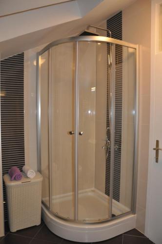 a shower with a glass door in a bathroom at Apartment Sea San in Makarska