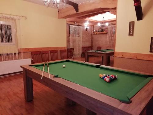a living room with a pool table and ping pong balls at ZAJAZD Wałbrzych in Wałbrzych