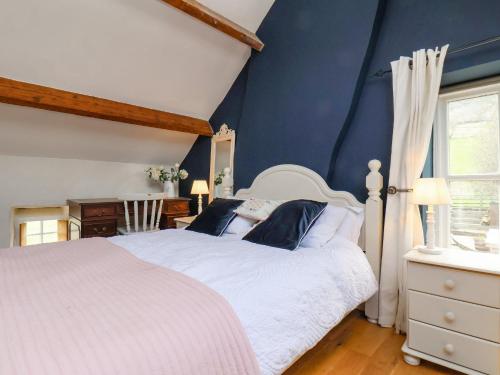 מיטה או מיטות בחדר ב-2 Primrose Villas