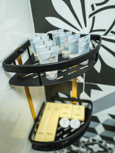 a tiered shelf with drinks on it at Affa Boutique Hotel in Hanoi