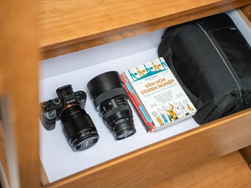 a drawer with two cameras and a book in it at Affa Boutique Hotel in Hanoi