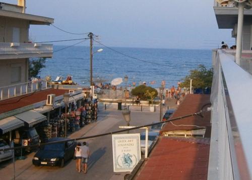 a view of a street with the ocean in the background at Rooms Anastasia Paralia in Paralia Katerinis