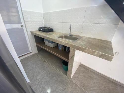 a small bathroom with a sink and a shower at Magic horizont in Taganga