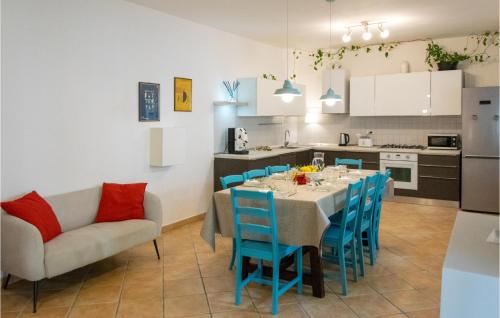 a kitchen and dining room with a table and chairs at Nice Home In Macerata With Wifi in Macerata