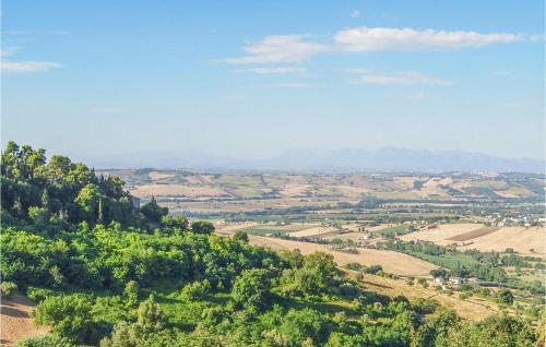 a view of a valley with trees and cultivated fields at Nice Home In Macerata With Wifi in Macerata