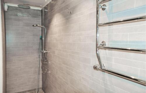 a shower with a glass door in a bathroom at Nice Apartment In Lima With Kitchen in Lima
