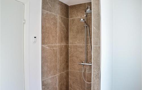 a bathroom with a shower with a glass door at 4 Bedroom Lovely Home In Dragr in Dragør