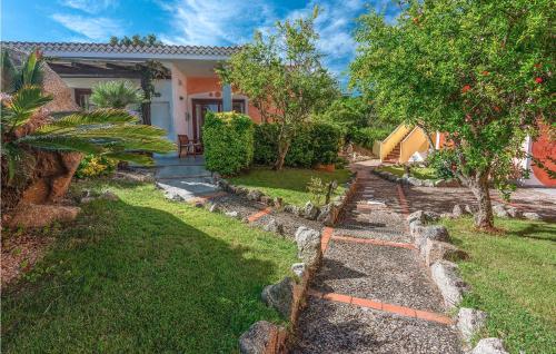 a house with a yard with a stone pathway at Mono 2 in Palau