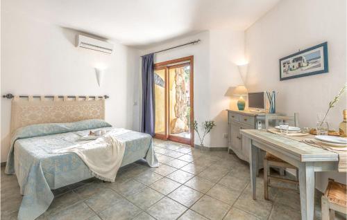 a bedroom with a bed and a table in it at Mono 2 in Palau