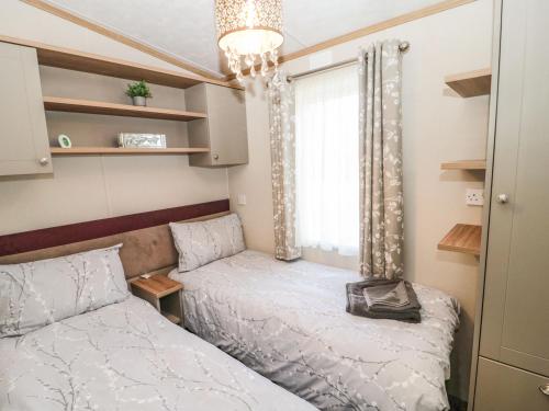 Postel nebo postele na pokoji v ubytování La Hacendia Lodge