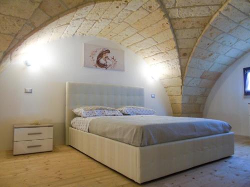 a bedroom with a large bed in an attic at Glem Luxury in Copertino