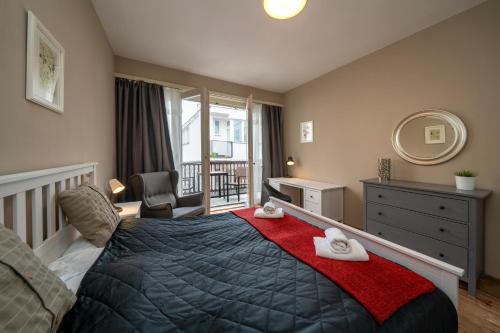 Postel nebo postele na pokoji v ubytování New Town - Apple Apartments
