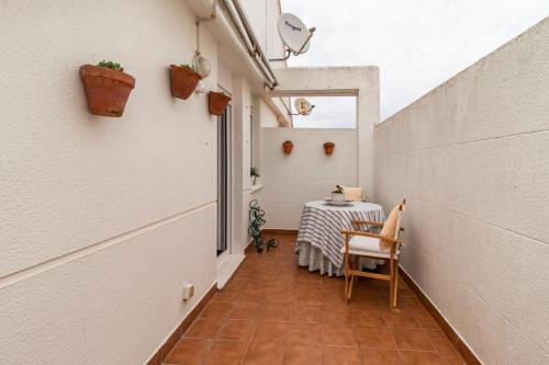 a small hallway with a table in a building at Rincón de Cantabria 1 in Santoña