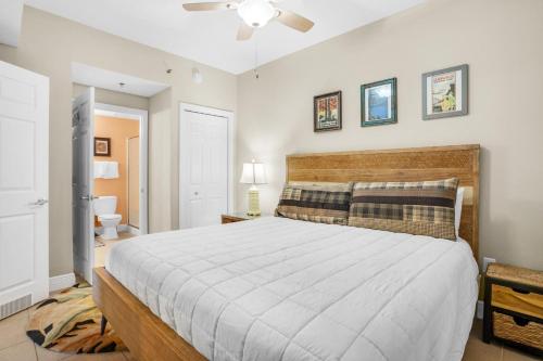 a bedroom with a large bed and a ceiling fan at Ariel Dunes I 1401 in Destin