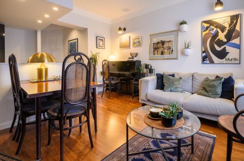 a living room with a couch and a table at Designer Two-Bedroom Apartment in Split