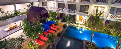 an overhead view of a hotel with a pool and chairs at Abian Harmony Hotel in Sanur
