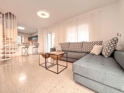 a living room with a couch and a table at Villa Julia in Callao Salvaje in Callao Salvaje