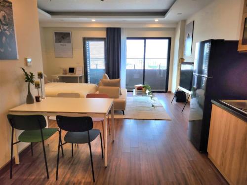 TV a/nebo společenská místnost v ubytování Quy Nhon Pearl - FLC Sea Tower