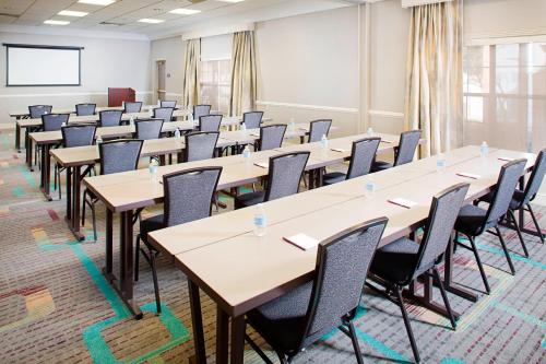 a room with rows of tables and chairs at Residence Inn Dallas Park Central in Dallas