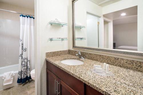 a bathroom with a sink and a mirror at Residence Inn Pasadena Arcadia in Arcadia