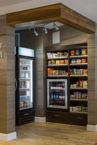 a kitchen with an open refrigerator with food at Fairfield by Marriott Waterbury Stowe in Waterbury