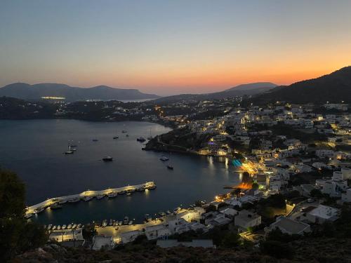 a view of a harbor at dusk at The Velanidies - Οι Βελανιδιές in Agia Marina
