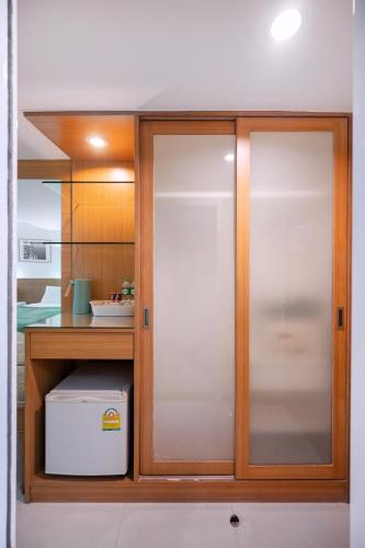 a cabinet with glass doors in a kitchen at P2 Boutique in Bangkok