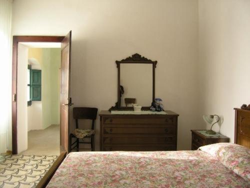 Giường trong phòng chung tại casa ottocentesca nel borgo