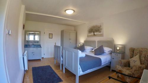 Postel nebo postele na pokoji v ubytování Hisa Brdo Guesthouse