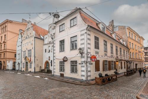 a group of buildings on a city street at St.Jacobs's apartments Old Town Riga in Riga