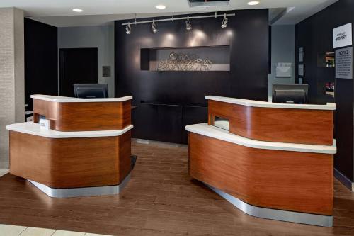 a dental office with wooden reception desks in a room at Courtyard by Marriott Houston Rice University in Houston