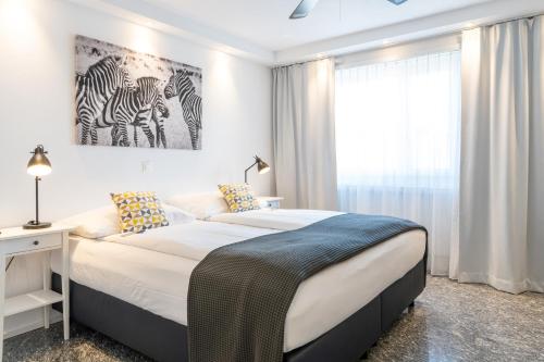 Postel nebo postele na pokoji v ubytování Hotel Sursee