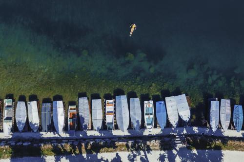a group of boats lined up in a row in the water at Chalet Molly by we rent in Zell am See