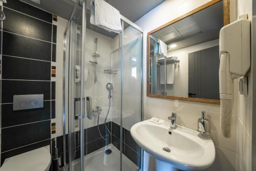 a bathroom with a sink and a shower at Club Beyy Resort Hotel - Ultra All Inclusive in İzmir