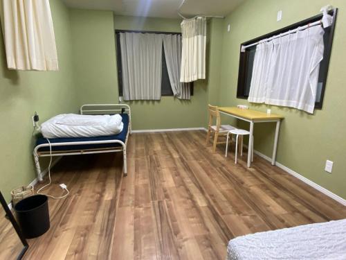 Ένα ή περισσότερα κρεβάτια σε δωμάτιο στο Bonfire Hostel Osaka