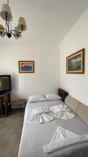 Кровать или кровати в номере GIANNIS-KLEOPATRA HOUSE 1