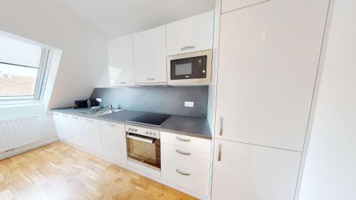 Kuchyň nebo kuchyňský kout v ubytování ALON HOMES Vienna - Premium City Center Apartments
