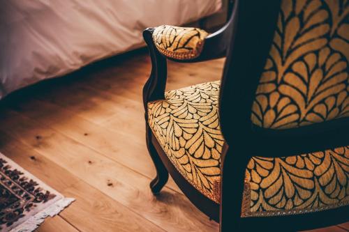 a close up of a chair with a tattoo on it at Château Ecrin de Lumière in Campsegret