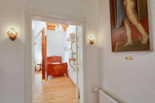 a hallway of a home with a painting on the wall at Nordpalais vor Sylt in Emmelsbüll-Horsbüll