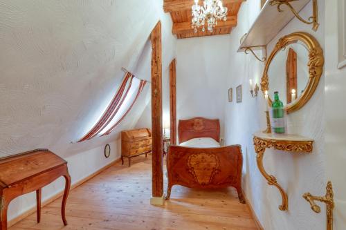 a bathroom with a vanity and a mirror and a sink at Nordpalais vor Sylt in Emmelsbüll-Horsbüll
