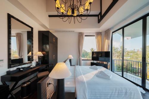 Postel nebo postele na pokoji v ubytování Yao Bada Badoo Boutique Resort