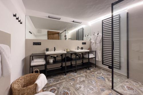 a bathroom with a sink and a mirror at Ansitz Zinnenberg in Appiano sulla Strada del Vino